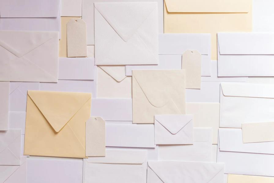 Assortment of white and yellow envelopes